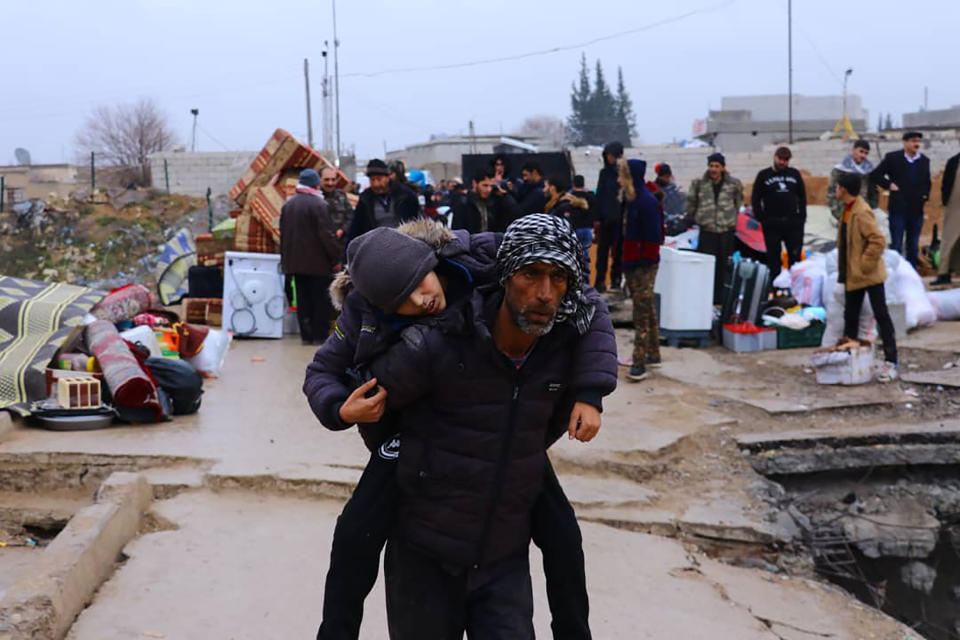 This photo provided on Jan. 30, 2020, by the Northern Democratic Brigade, a group of the US-backed Kurdish-led Syrian democratic forces, shows displaced Syrians fleeing the Syrian military offensive in Idlib province, as they arrive in Manbij town, north Syria. Hundreds of thousands of Syrians have fled recent government bombardment of the last rebel bastion, the northwestern Idlib province, seeking shelter from harsh winter weather in muddy tents and half-constructed buildings. As government forces advance, areas deemed safe are rapidly shrinking. (Northern Democratic Brigade, via AP)