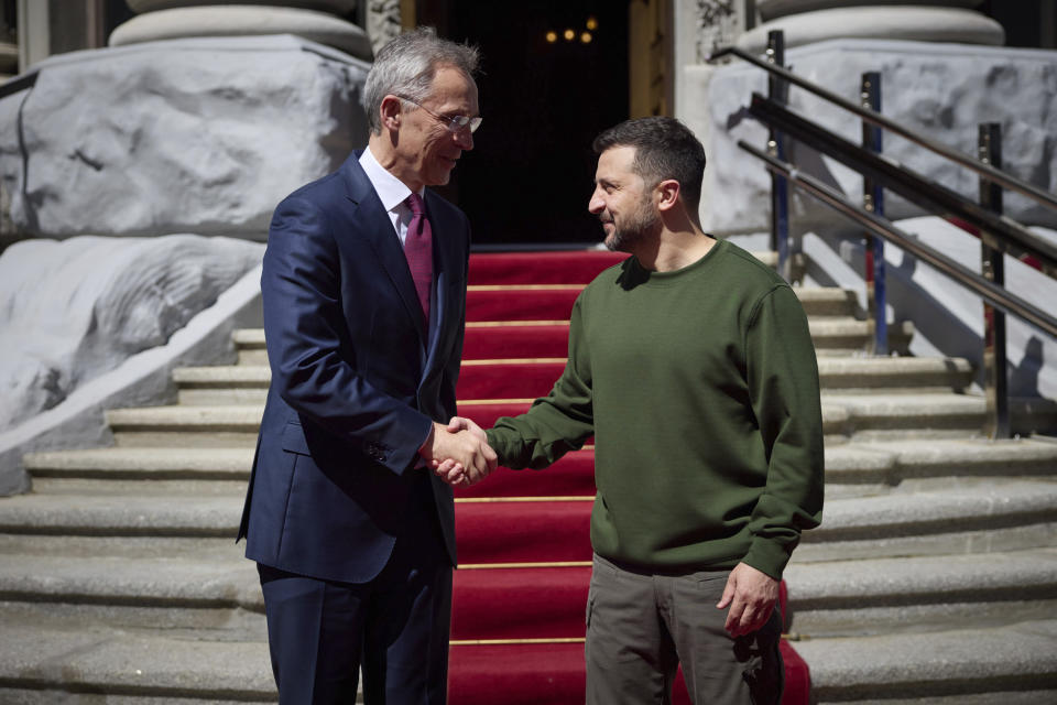 Ukrainian President Volodymyr Zelenskyy, right, welcomes NATO Secretary General Jens Stoltenberg during their meeting in Kyiv, Ukraine, Monday, April 29, 2024. (Ukrainian Presidential Press Office via AP)