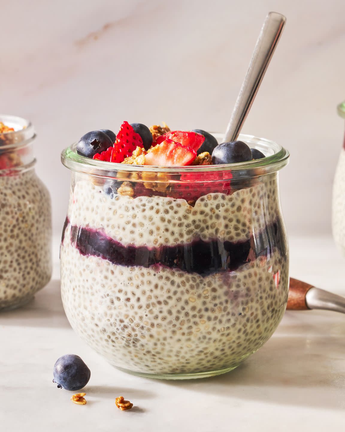 chia pudding with berries, granola, and jam