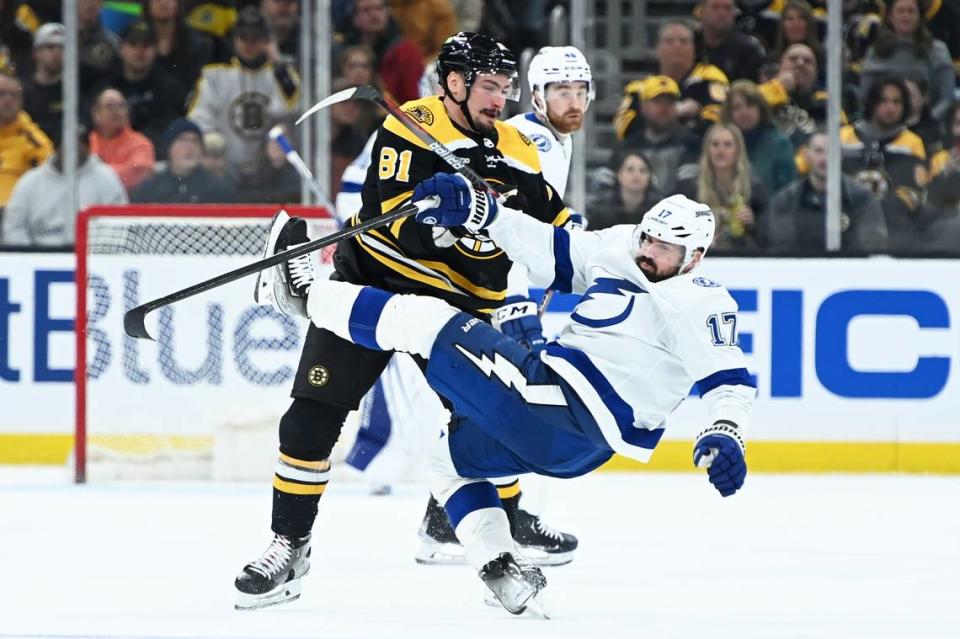 Mar 25, 2023; Boston, Massachusetts, USA; Boston Bruins defenseman Dmitry Orlov (81) checks Tampa Bay Lightning left wing Alex Killorn (17) during the second period at TD Garden. Mandatory Credit: Bob DeChiara-USA TODAY Sports