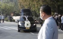 A hearse of the late Samsung Electronics chairman Lee Kun-Hee leaves outside a funeral hall in Seoul, South Korea, Wednesday, Oct. 28, 2020. Lee, who transformed the small television maker into a global giant of consumer electronics but whose leadership was also marred by corruption convictions, died on Sunday at the age of 78. (AP Photo/Lee Jin-man)