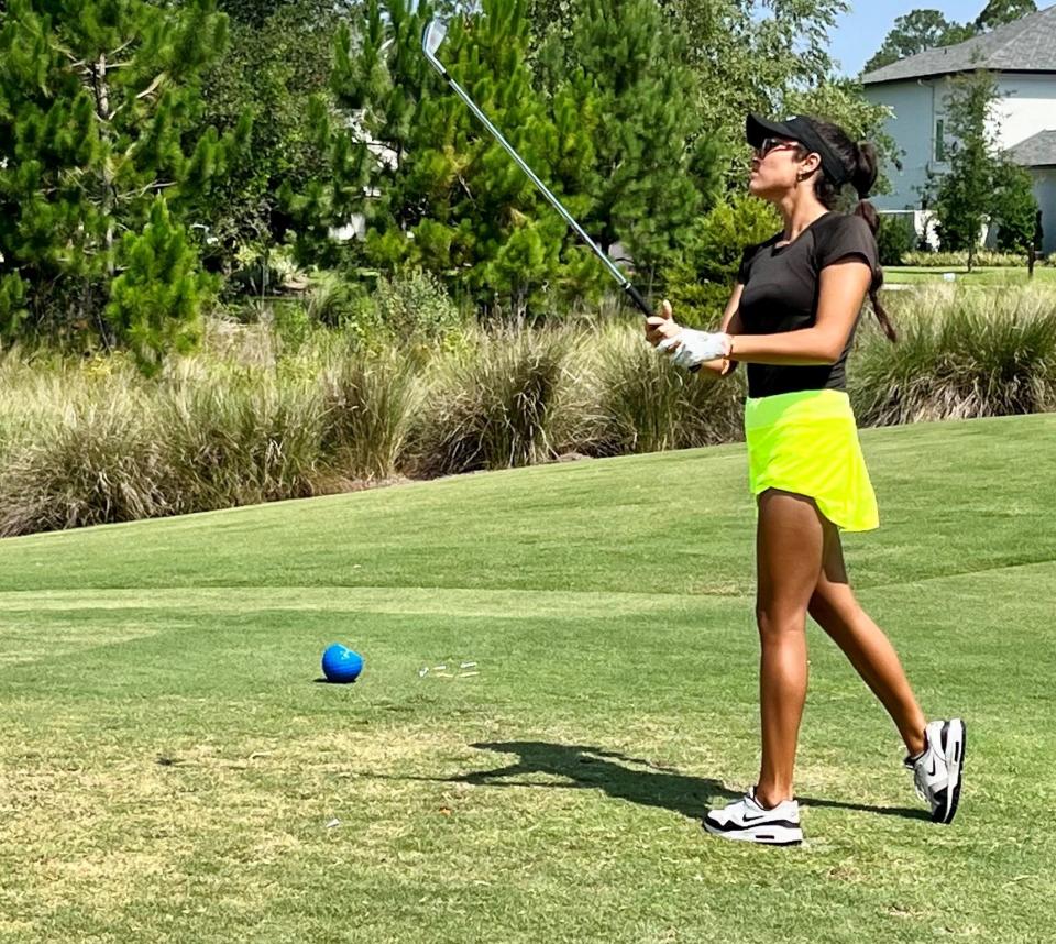 Eliabeth Kondal of St. Augustine watches the flight of her tee shot at the par-3 14th hole of the King & Bear on Thursday during the second round of the First Coast Women's Amateur.