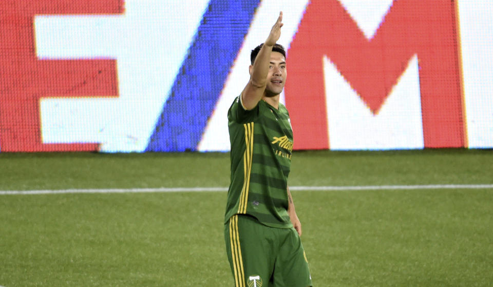 Portland Timbers forward Felipe Mora celebrates after scoring a goal during the first half of an MLS soccer match against the Vancouver Whitecaps in Portland, Ore., Sunday, Sept. 27, 2020. (AP Photo/Steve Dykes)