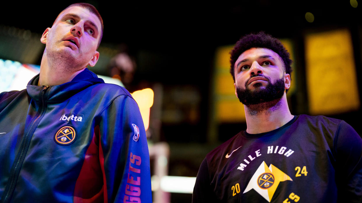 LOS ANGELES, CA - APRIL 27: Nikola Jokic #15 and  Jamal Murray #27 of the Denver Nuggets look on before the game against the Los Angeles Lakers during Round 1 Game 4 of the 2024 NBA Playoffs on April 27, 2024 at Crypto.Com Arena in Los Angeles, California. NOTE TO USER: User expressly acknowledges and agrees that, by downloading and/or using this Photograph, user is consenting to the terms and conditions of the Getty Images License Agreement. Mandatory Copyright Notice: Copyright 2024 NBAE (Photo by Tyler Ross/NBAE via Getty Images)