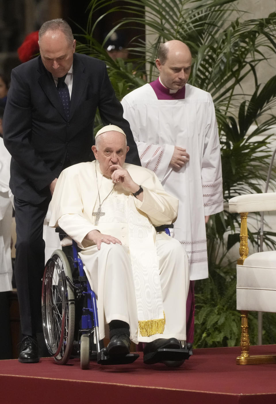 Pope Francis arrives in St. Peter's Basilica at The Vatican to preside over a mass in honor of our lady of Guadalupe, Monday, Dec. 12, 2022. (AP Photo/Gregorio Borgia)