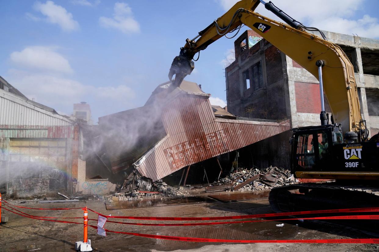 A bulldozer goes into action after the city of Detroit announces a new phase in demolition of the Packard Plant in Detroit on Monday, March 4, 2024.