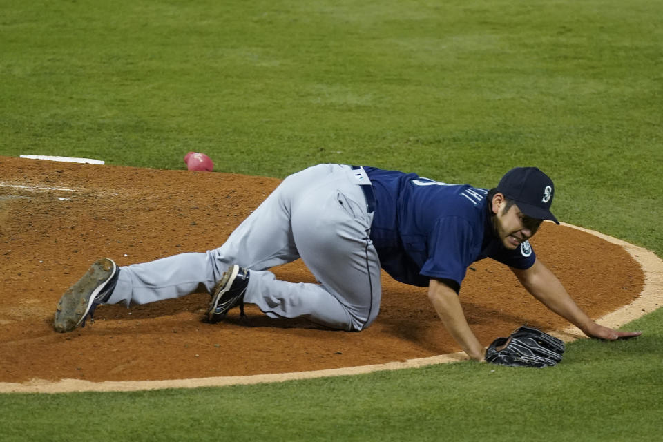 Seattle Mariners starting pitcher Yusei Kikuchi (18) reacts after being hit by a ball hit by Los Angeles Angels' David Fletcher during the fifth inning of a baseball game Saturday, June 5, 2021, in Anaheim, Calif. (AP Photo/Ashley Landis)