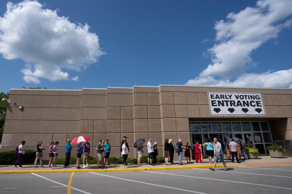 Voters line up in front of the Franklin County Board of Elections to vote early for the Aug. 8 special election.