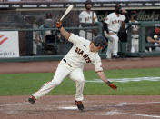 San Francisco Giants' Alex Dickerson spins around after getting hit by a ball that bounced off his bat during the fifth inning of a baseball game against the Arizona Diamondbacks, Monday, Sept. 7, 2020, in San Francisco. (AP Photo/Tony Avelar)
