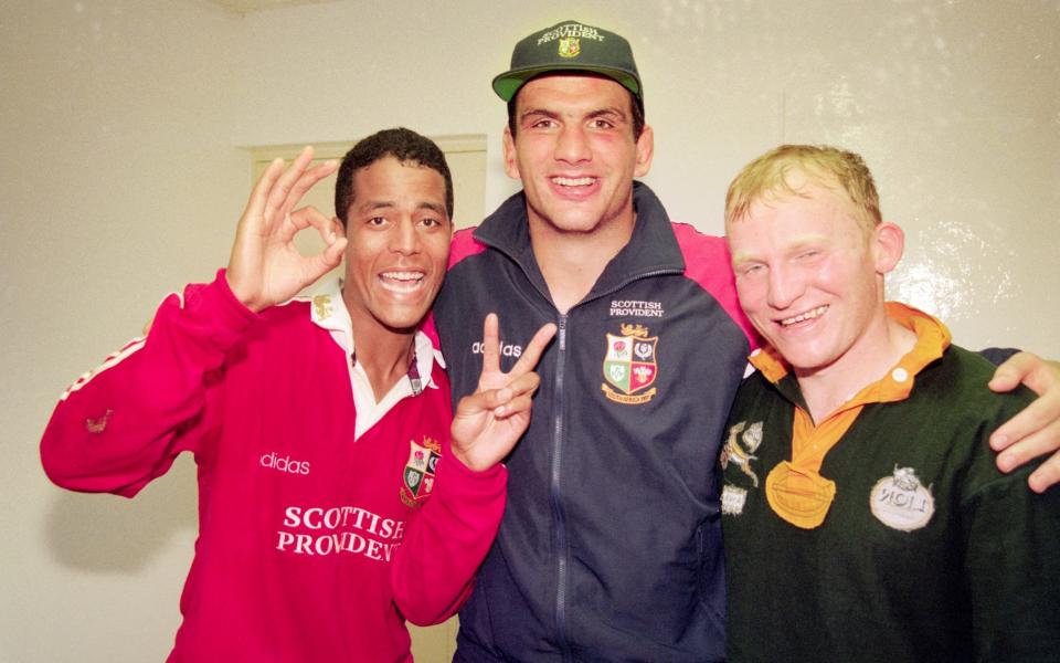 Lions players Jeremy Guscott (l) Martin Johnson and Neil Jenkins (r) celebrate in the dressing room - HULTON ARCHIVE