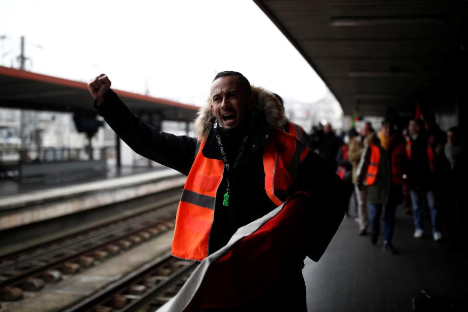 French SNCF railway workers on strike walk on a platform at Gare du Nord railway station before a demonstration against French government's pensions reform plans in Paris as part of a day of national strike and protests in France, December 5, 2019.