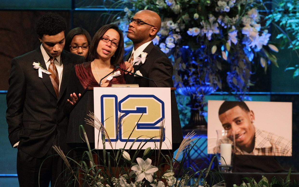 FILE - Hundreds, including DJ's brother Kyle Henry, right, DJ's sister Amber Henry, second from right, and best friend Brandon Cox, third from right, showed up for the candlelight prayer vigil held in Easton, Oct. 18, 2010, in honor of the late Danroy "DJ" Henry Jr., who was shot and killed by a police officer in New York.