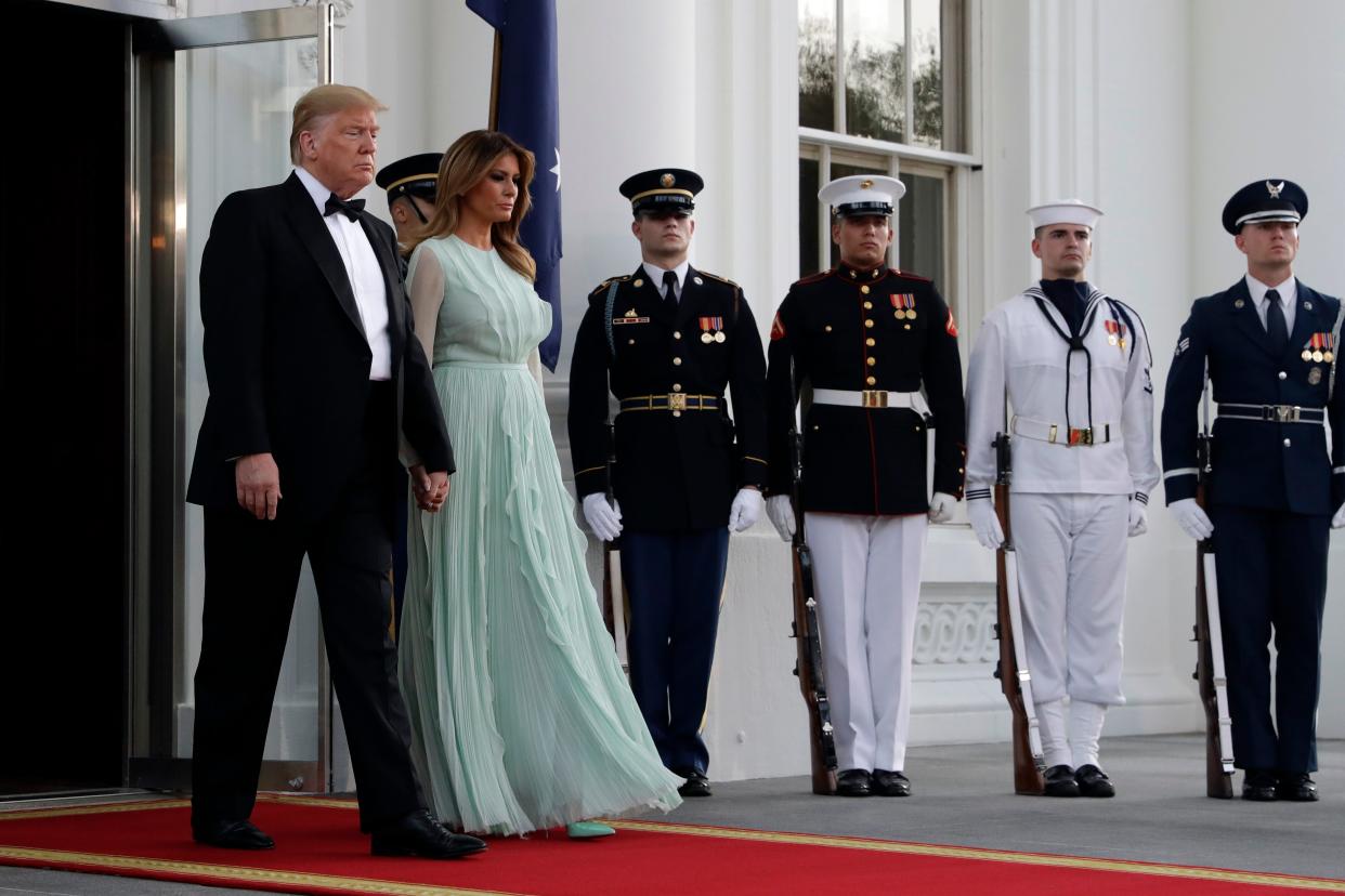 President Donald Trump and first lady Melania Trump walk to welcome Australian Prime Minister Scott Morrison and his wife Jenny Morrison to a state dinner at the White House, Sept. 20, 2019.