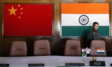 A man walks inside a conference room used for meetings between military commanders of China and India, at the Indian side of the Indo-China border at Bumla, in Arunachal Pradesh, November 11, 2009. REUTERS/Adnan Abidi/Files