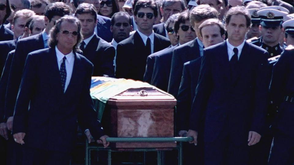 Gerhard Berger (right) carried Ayrton Senna's coffin in Sao Paulo. Pic: AAP