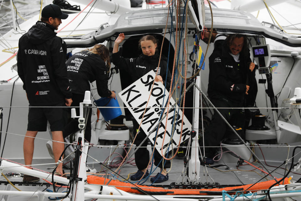 NEW YORK, NEW YORK - AUGUST 28: Teenage climate activist Greta Thunberg holding a sign that says "school Strike for Climate" in swedish arrives into New York City after crossing the Atlantic in a sailboat on on August 28, 2019 in New York City. The 16-year-old Swedish activist began her journey from Plymouth, England, on Aug. 14 and sailed to New York to speak at the UN Climate Action Summit on September 23. Thunberg, who has started a global series of youth protests around climate change, traveled by sail boat as she wanted a zero-carbon emissions vessel. (Photo by Spencer Platt/Getty Images)