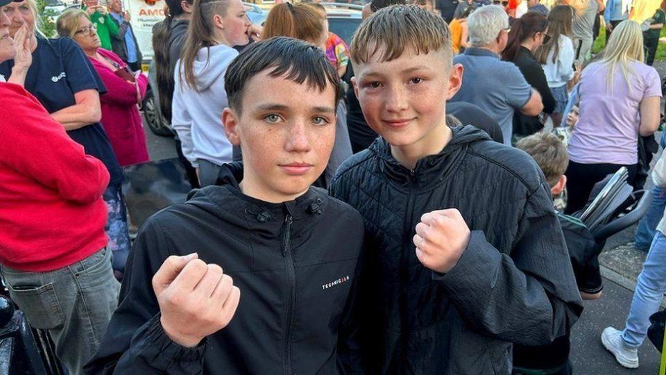 Harry Hassin and Jerry McCann attending Anthony Cacace's homecoming in west Belfast