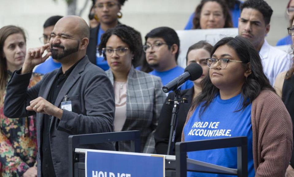 Gisselle Contreras, at podium, daughter of an immigrant detained at Adelanto, California, describes her father’s housing conditions before his final deportation to Guatemala.