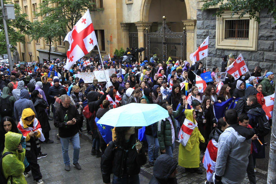 Demonstrators attend an opposition protest against "the Russian law" near the Parliament building in the center of Tbilisi, Georgia, Tuesday, May 14, 2024. Georgia's parliament on Tuesday began the third and final reading of a divisive bill that sparked weeks of mass protests, with critics seeing it as a threat to democratic freedoms and the country's aspirations to join the European Union. (AP Photo/Shakh Aivazov)