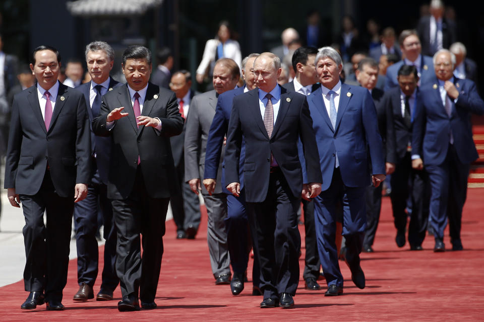 Chinese President Xi Jinping walks with Russian President Vladimir Putin and other leaders at the Belt and Road Forum outside Beijing in May 2017. (Photo: Damir Sagolj/Pool Photo via AP)