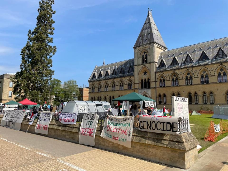 Banners on the walls around the lawn in front of Oxford University’s Natural History Museum (The Independent)