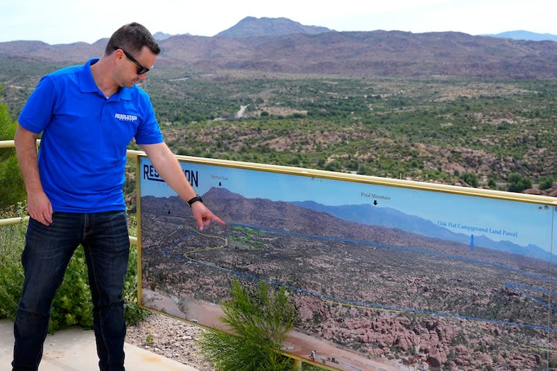 Resolution Mining Company spokesman Tyson Nansel shows the locations of the proposed new mining site and Oak Flat Campground, in Miami, Arizona. | Matt York