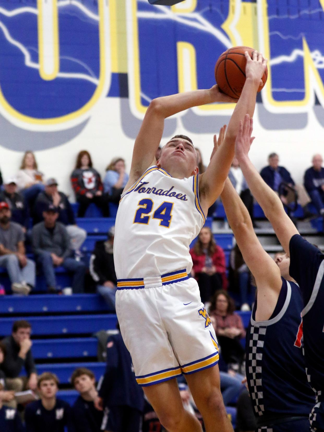 Carter Smith goes up in the lane during West Muskingum's 64-51 win against visiting Morgan on Friday night at Gary Ankrum Gymnasium in Falls Township. Smith finished with a team-high 20 points.