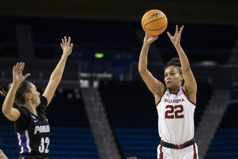 Oklahoma guard Ana Llanusa (22) shoots over Portland guard Kelsey Lenzie (32) during the first half of a first-round college basketball game in the women's NCAA Tournament, Saturday, March 18, 2023, in Los Angeles. (AP Photo/Kyusung Gong)