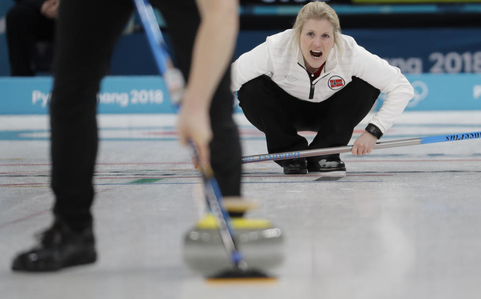 Norway’s Kristin Skaslien watches her teammate Magnus Nedregotten sweep the ice during a mixed double curling match against Canada’s Kaitlyn Lawes and John Morris at the 2018 Winter Olympics in Gangneung, South Korea, Thursday, Feb. 8, 2018. (AP Photo/Natacha Pisarenko)