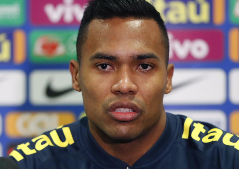 FILE -- In this Nov. 19, 2018 file photo Brazil's Alex Sandro speaks during a press conference ahead of the International friendly soccer match between Brazil and Cameroon, at MK Stadium in Milton Keynes, England. Alex Sandro has renewed his contract with Juventus until 2023, Juventus announced with a statement on its website Thursday, Dec. 20, 2018. (AP Photo/Frank Augstein)