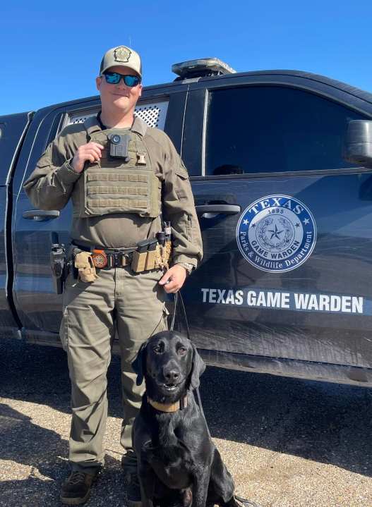 <em>Texas Parks and Wildlife Game Warden David McMillen and his K9 partner Jake, courtesy of Texarkana Police Department.</em>