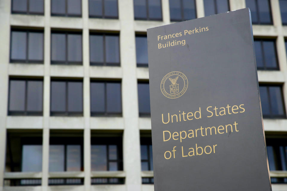 In this May 6, 2020 photo, a sign stands outside the Department of Laborâs headquarters in Washington. (AP Photo/Patrick Semansky)