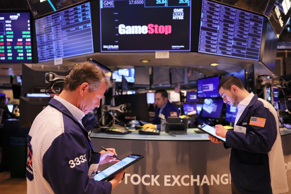 Traders work on the floor of the New York Stock Exchange during morning trading on March 22, 2023, in New York City. Stocks opened slightly low ahead of Federal Reserve Chair Jerome Powell’s next decision on whether to continue increasing interest rates to tame inflation after the conclusion of the Federal Reserve’s two-day policy meeting.