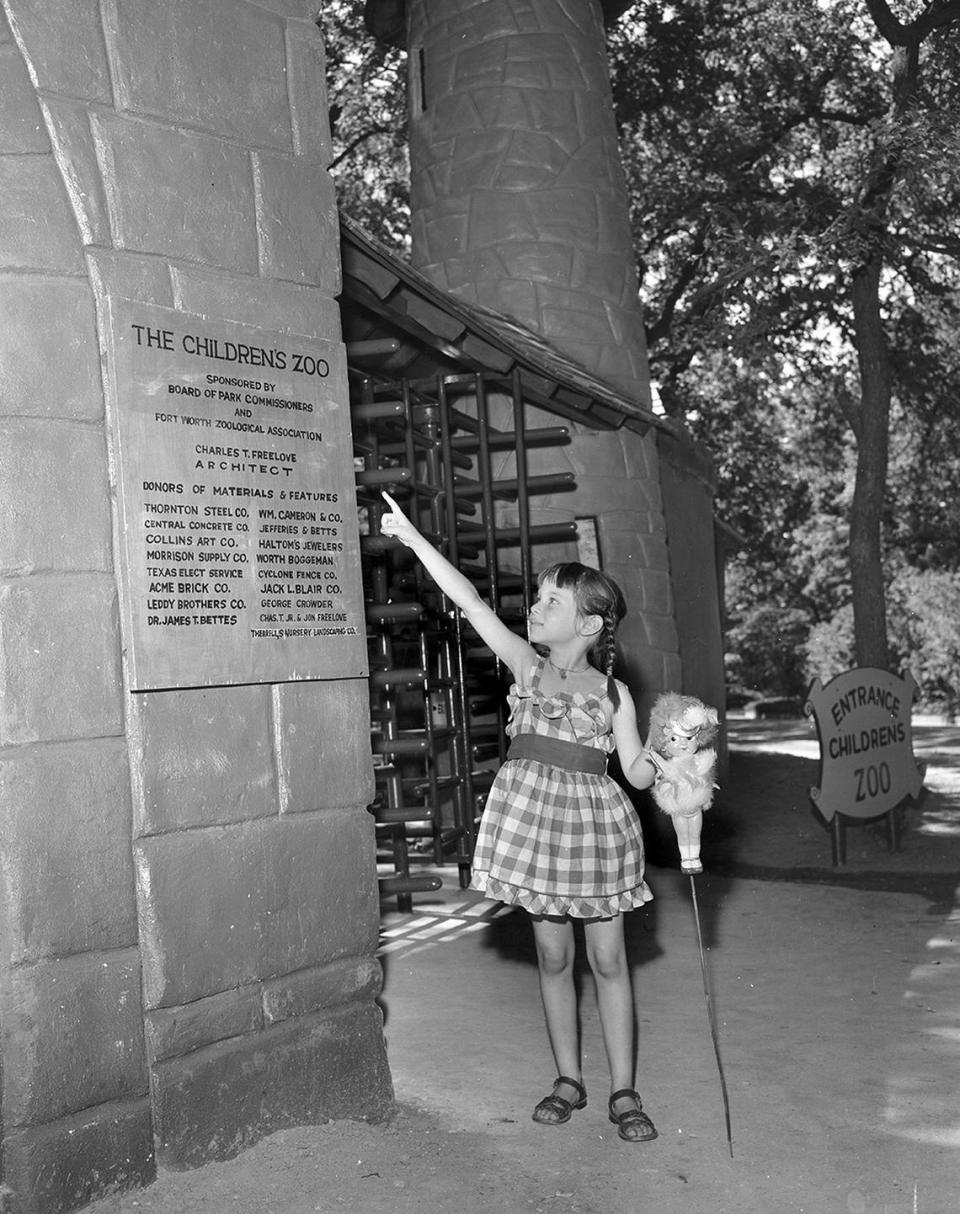 June 20, 1953: Six-year-old Kim Gottlieb points at the list of donors who helped bring to life the scenes of the nursery rhymes at Forest Park’s Children’s Zoo. The present plaque will be replaced with a bronze one. Kim is the daughter of Mr. and Mrs. Seymour Gottlieb.