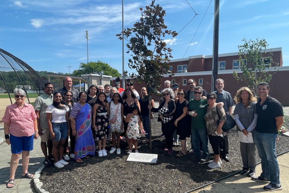 Woodland Park officials, friends and family of Daniel Girlando, Sr. dedicated a tree and a plaque in August to commemorate the death of the long-time volunteer.