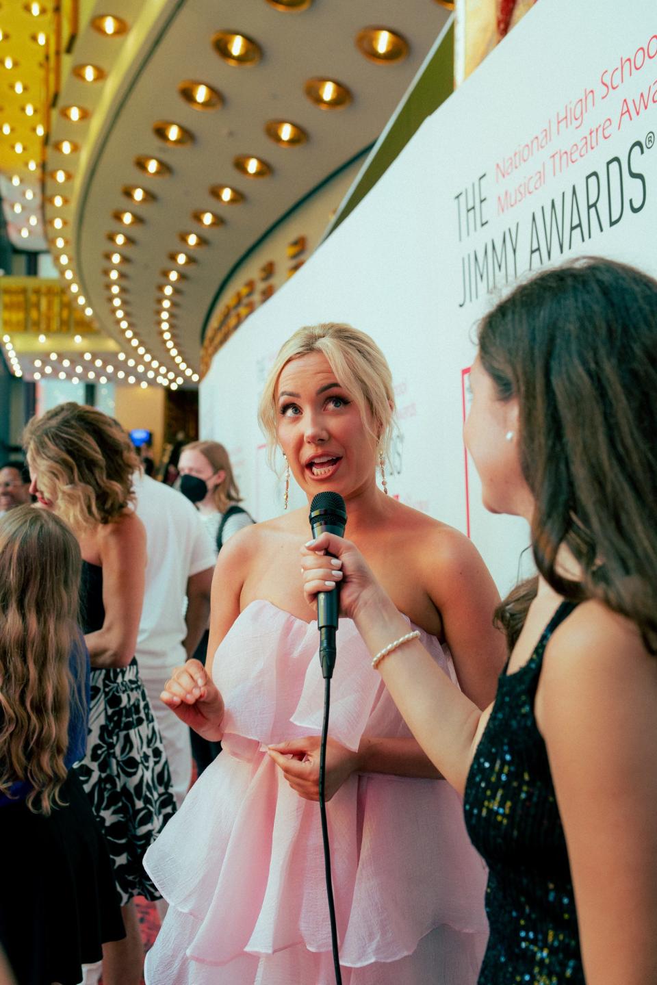 JD Davis, a recent graduate of Harrison School for the Arts, captured this image of a fellow student reporter interviewing actor McKenzie Kurtz, who plays Glinda in “Wicked” on Broadway. Davis was one of two student reporters selected to cover the event.