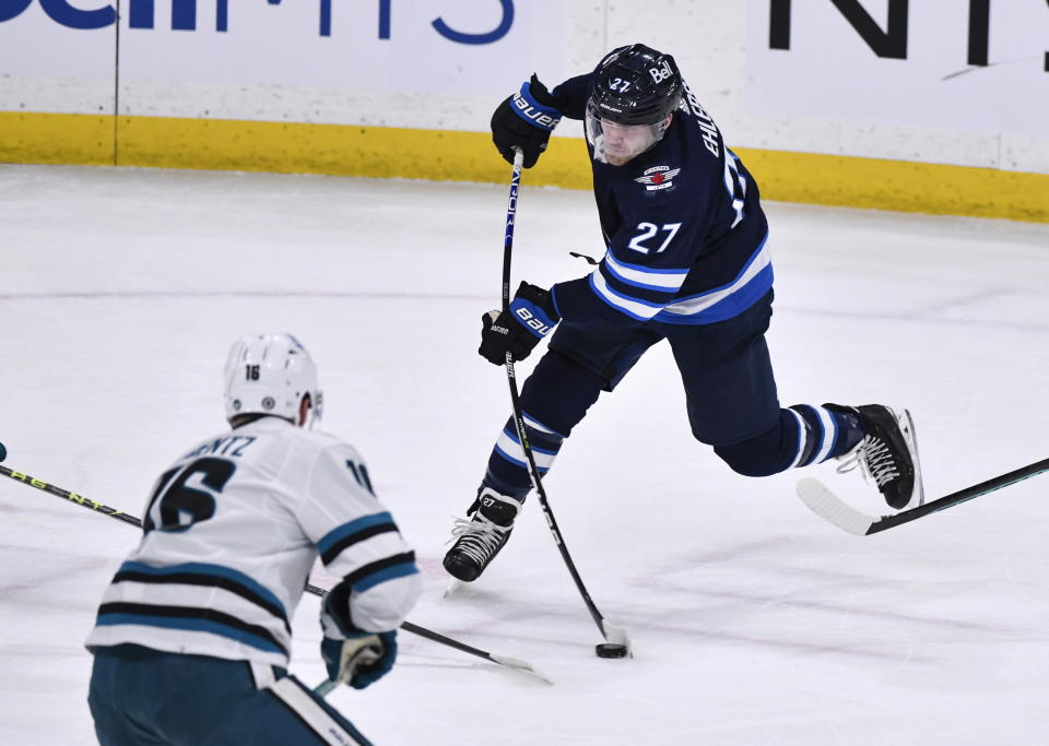 Winnipeg Jets' Nikolaj Ehlers (27) shoots toward the San Jose Sharks' net during first-period NHL hockey game action in Winnipeg, Manitoba, Monday, March 6, 2023. (Fred Greenslade/The Canadian Press via AP)