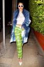 <p>Rihanna sports a chic pixie cut, blue faux fur coat and green tie dye pants to Giorgio Baldi for a late dinner on Wednesday in Santa Monica.</p>