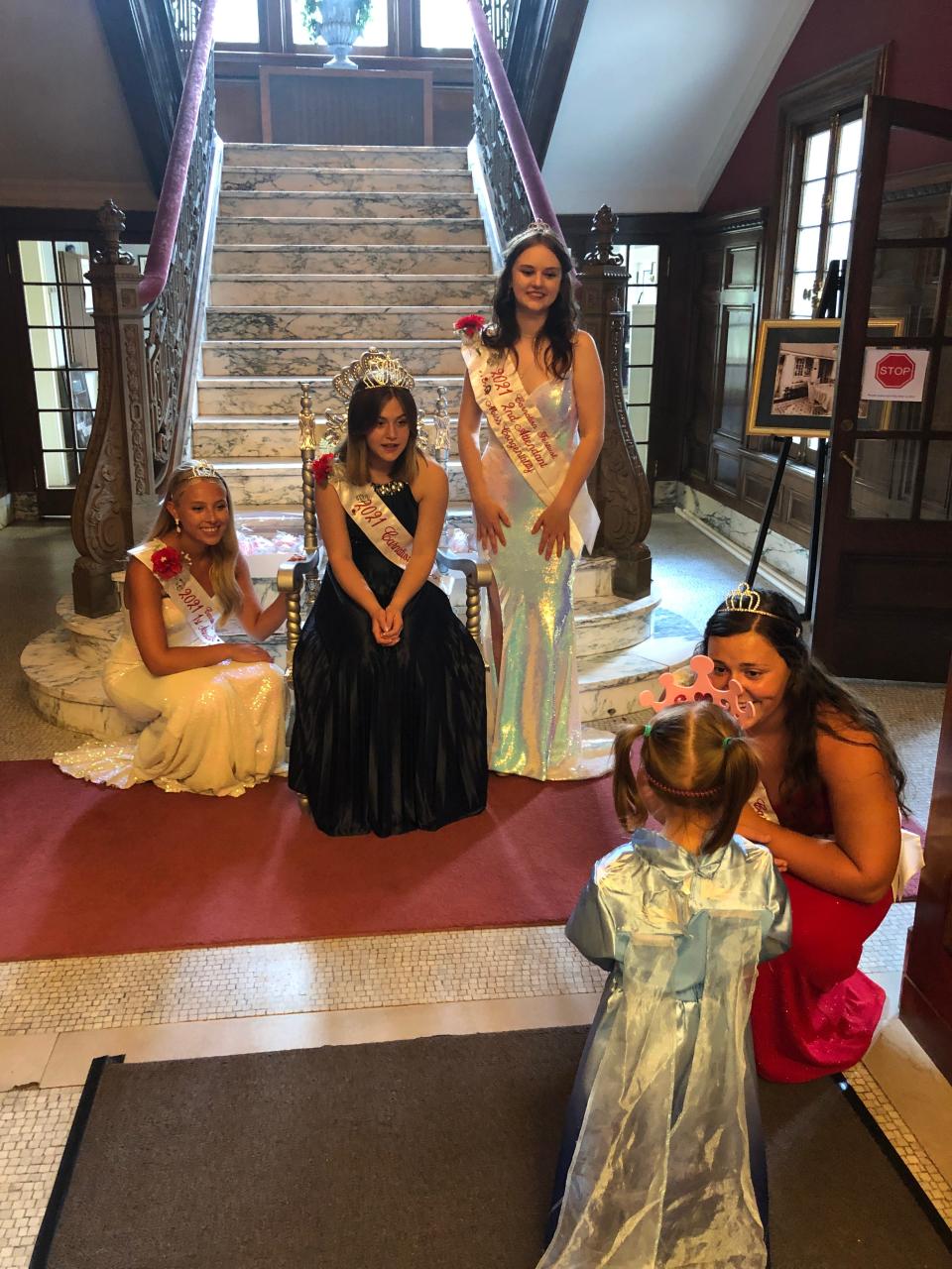 Torrie Forrest, 2021 Carnation Festival queen, and her court welcomed and took photos with little girls who came Sunday, June 24, 2022, to "A Royal Afternoon at The Castle" event at Glamorgan Castle in Alliance. Her court includes First Attendant Madeline Davis, Second Attendant and Miss Congeniality Bethany Caruthers and Third Attendant Leah Spinger. Here, they are meeting 3-year-old Madison Cribb of Ravenna.