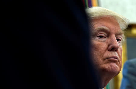 FILE PHOTO: U.S. President Donald Trump listens while receiving an update on Hurricane Harvey recovery efforts at the White House in Washington, U.S., September 1, 2017. REUTERS/Kevin Lamarque