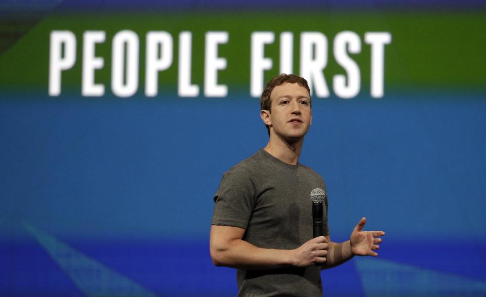 Facebook CEO Mark Zuckerberg gestures while delivering the keynote address at the f8 Facebook Developer Conference Wednesday, April 30, 2014, in San Francisco. (AP Photo/Ben Margot)