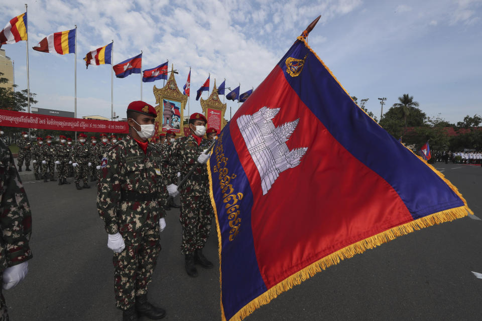 Cambodia soldiers participate in the country's 67th Independence Day celebration, in Phnom Penh, Cambodia, Monday, Nov. 9, 2020. (AP Photo/Heng Sinith)