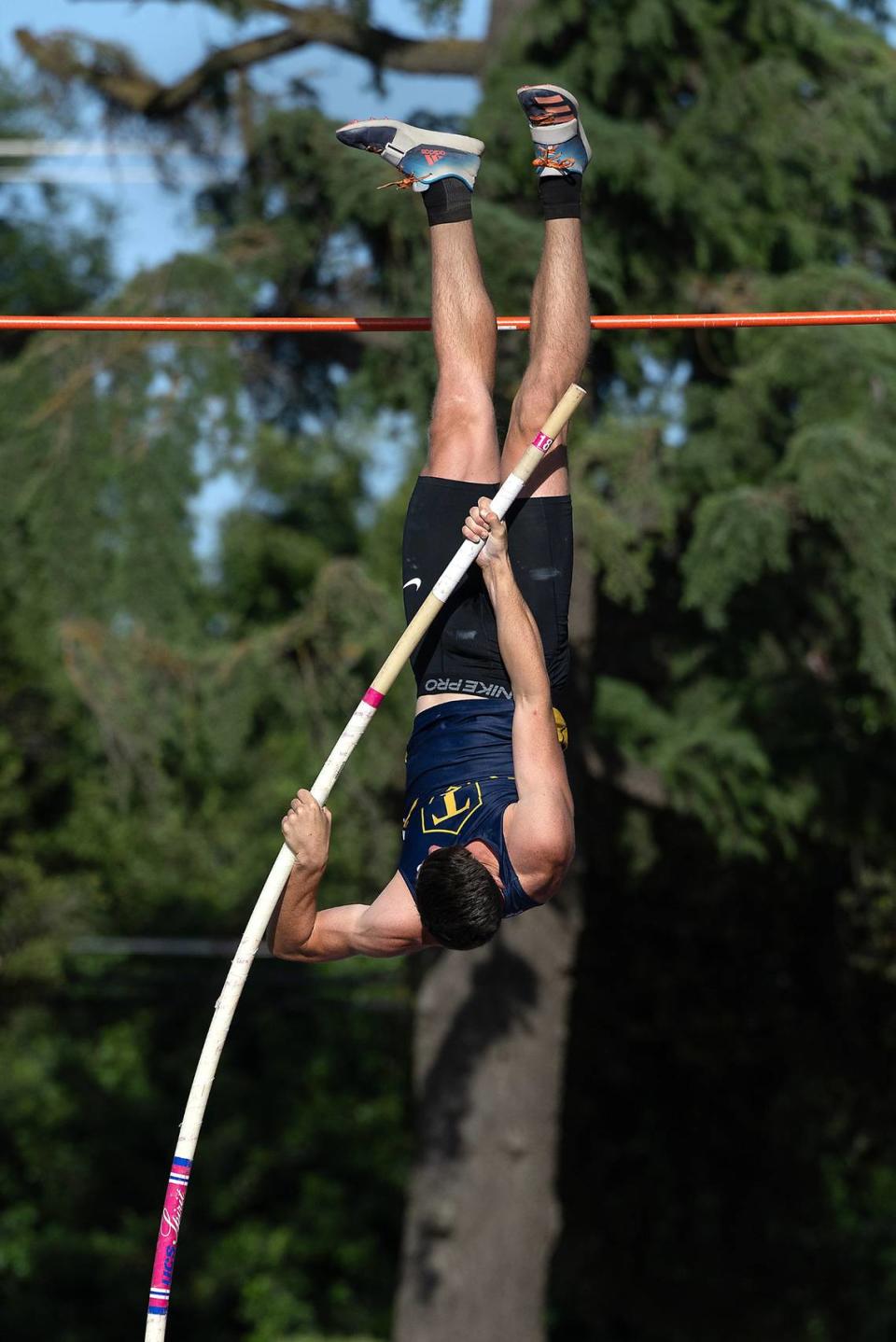 Turlock vaulter Maxwell McFarlane clears 14-10.00 to win the boys pole vault in the Central California Athletic League Championships at Downey High School in Modesto, Calif., Wednesday, May 1, 2024.