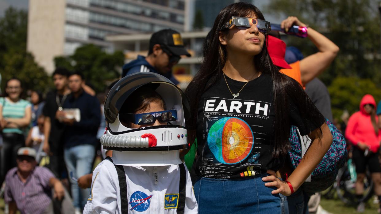  : People observe the Annular Solar Eclipse with using safety glasses at the facilities of the National Autonomous University of Mexico (UNAM) in Mexico City, Mexico on October 14, 2023. (. 