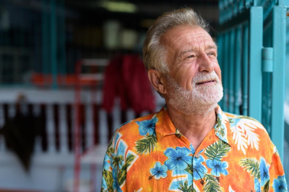 older man wearing orange floral shirt, over 50 regrets