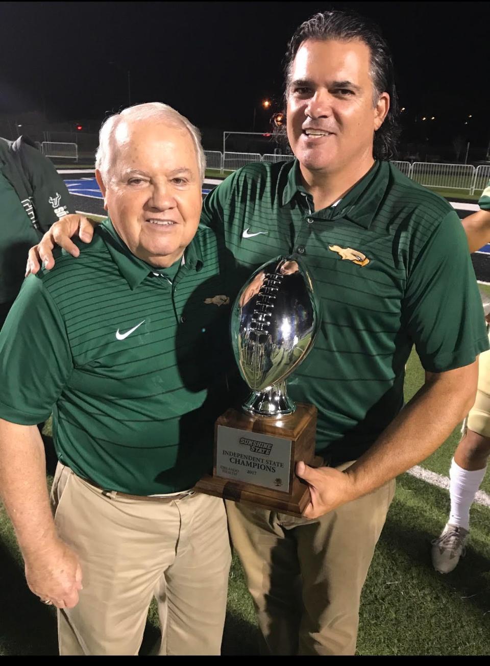 Tod Creneti stands with his dad, Frank, after the Saint Stephen's football team won the 2017 Sunshine State Athletic Conference championship.