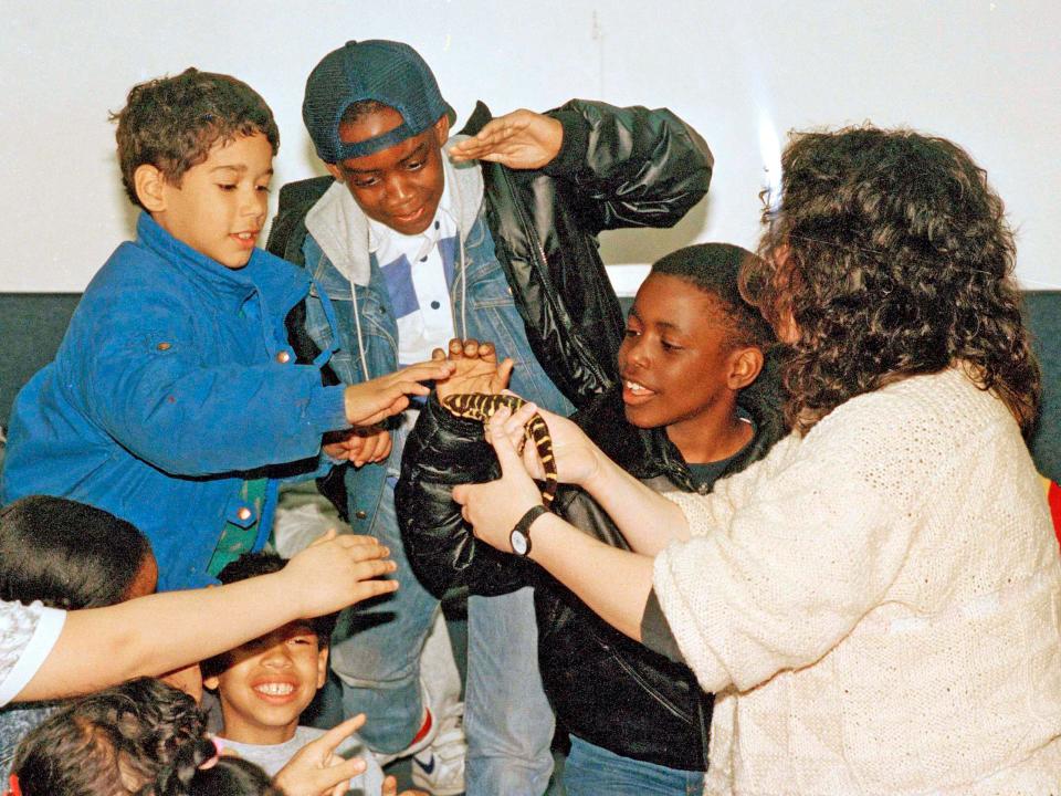 Students pet a salamander at The Bronx Zoo in 1988