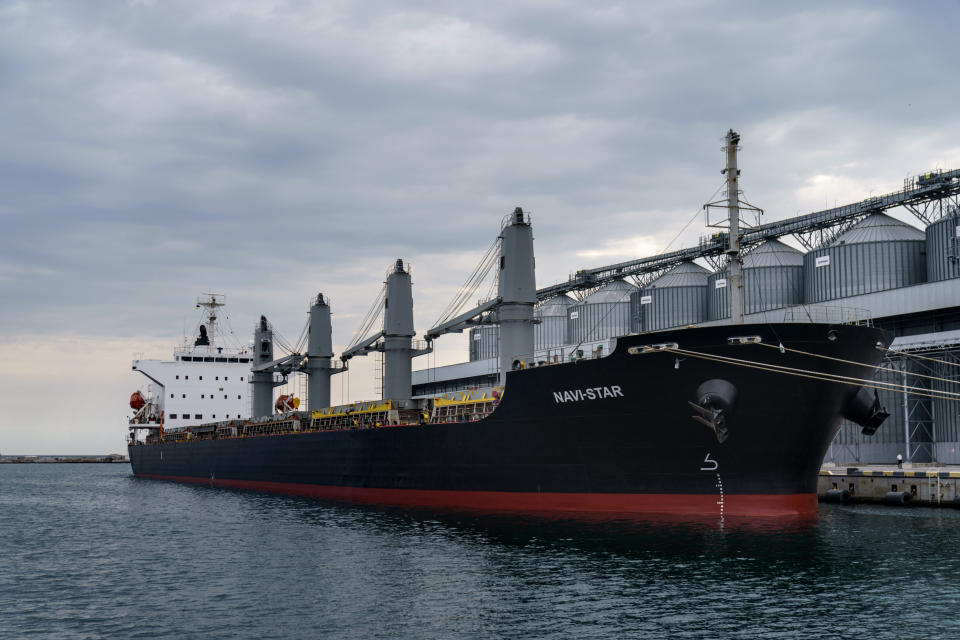 The ship Navi-Star sits full of grain since Russia's invasion of Ukraine began five months ago as it waits to sail from the Odesa Sea Port, in Odesa, Ukraine, Friday, July 29, 2022. (AP Photo/David Goldman)