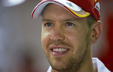 Ferrari's Sebastian Vettel of Germany in the team garage at the Marina Bay street circuit ahead of the Singapore F1 Grand Prix Night Race in Singapore, September 15, 2016. REUTERS/Jeremy Lee