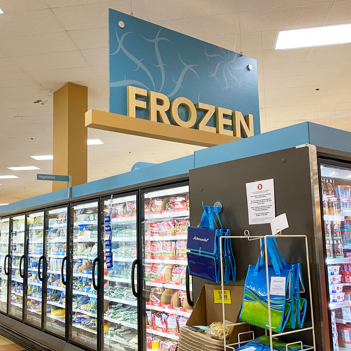 frozen food aisle in grocery store